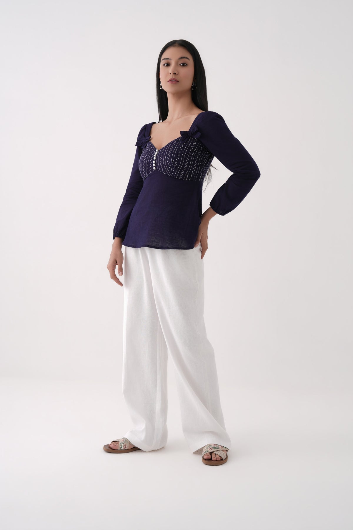 dark blue embroidered sweetheart peplum top
