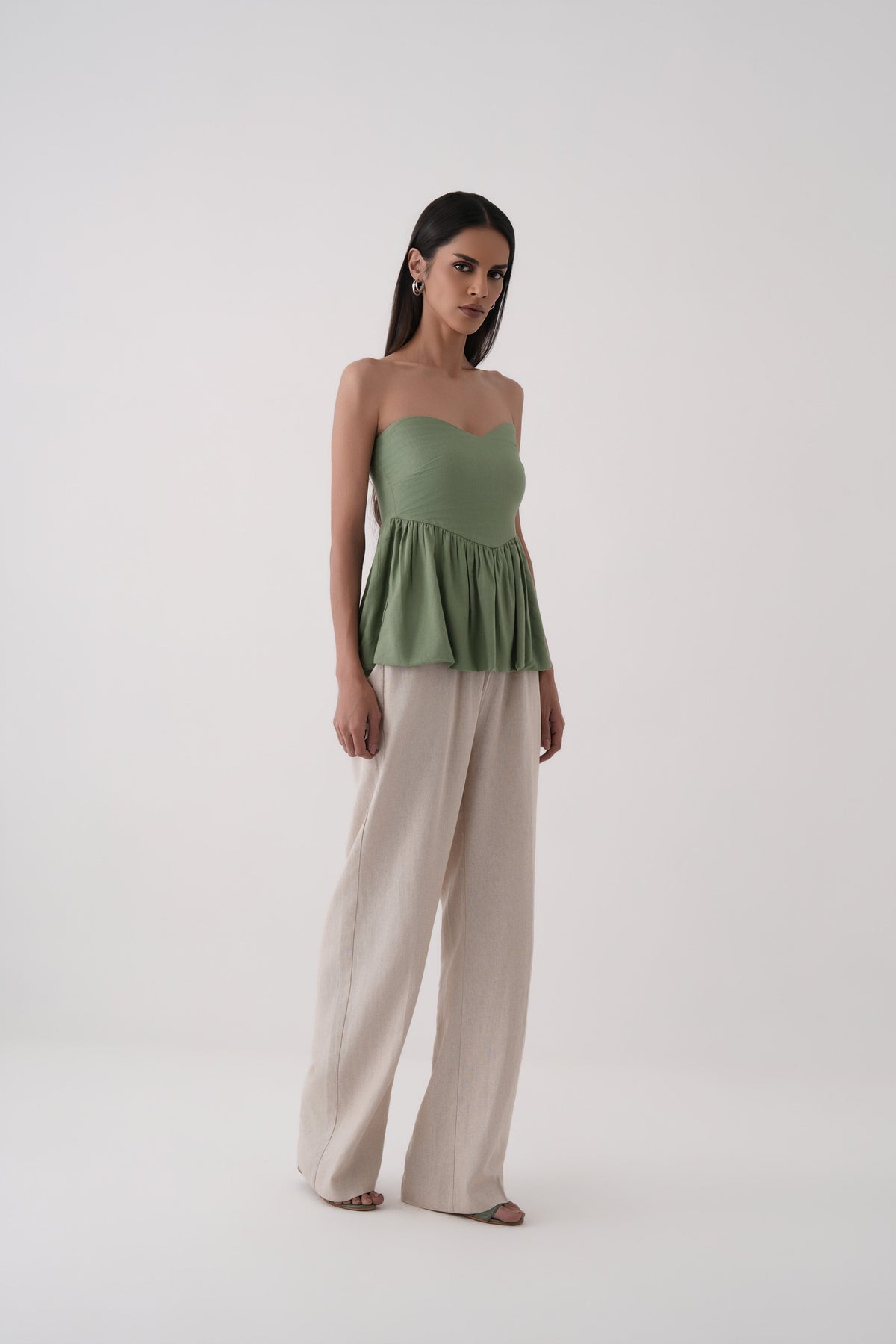 green strapless bubble hem peplum top