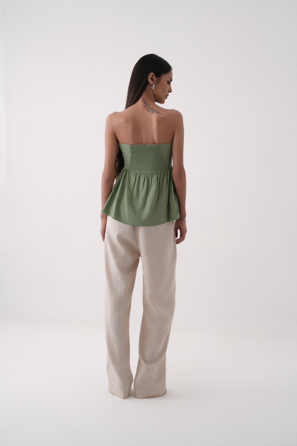 green strapless bubble hem peplum top