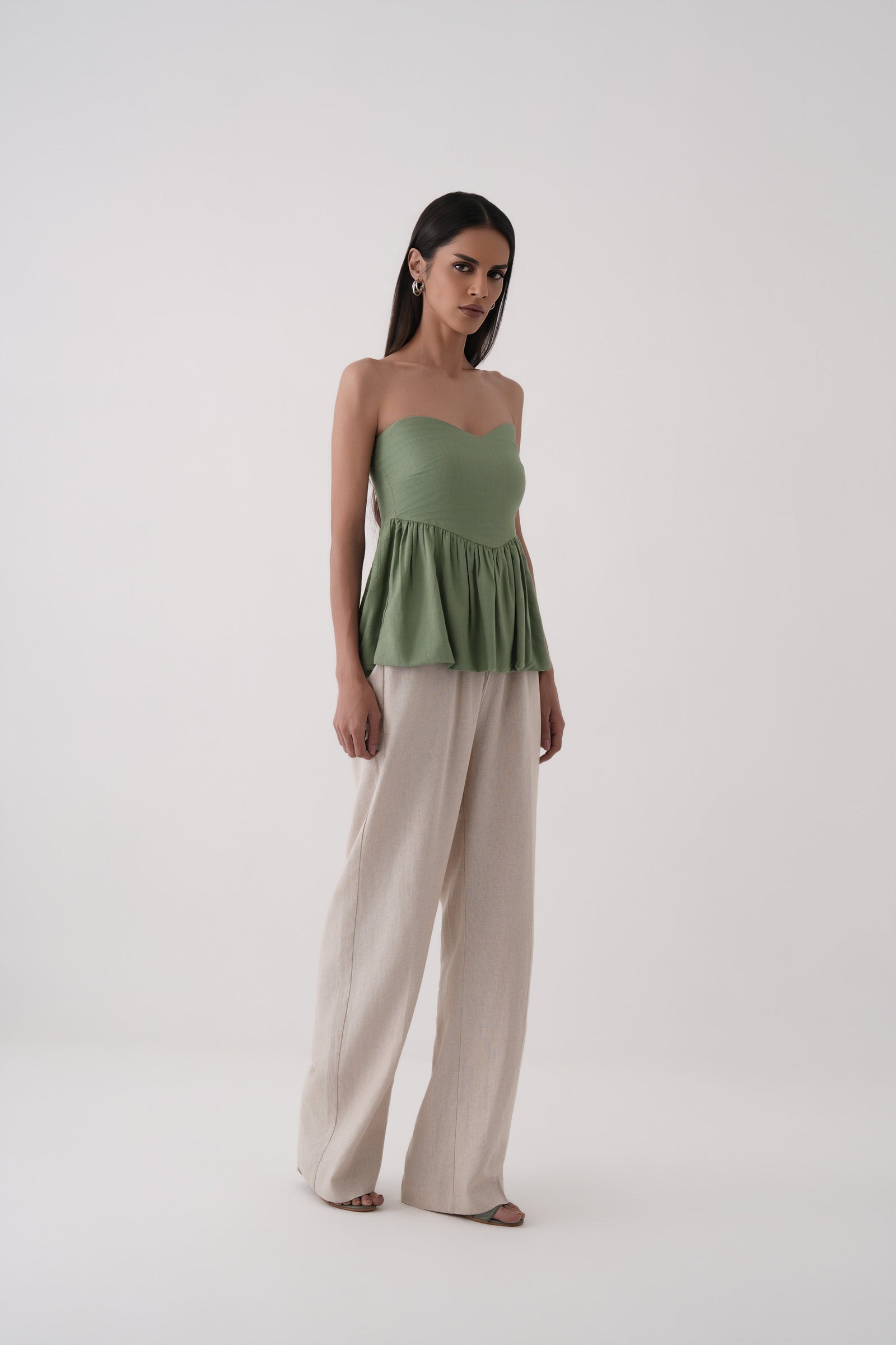 green strapless bubble hem peplum top