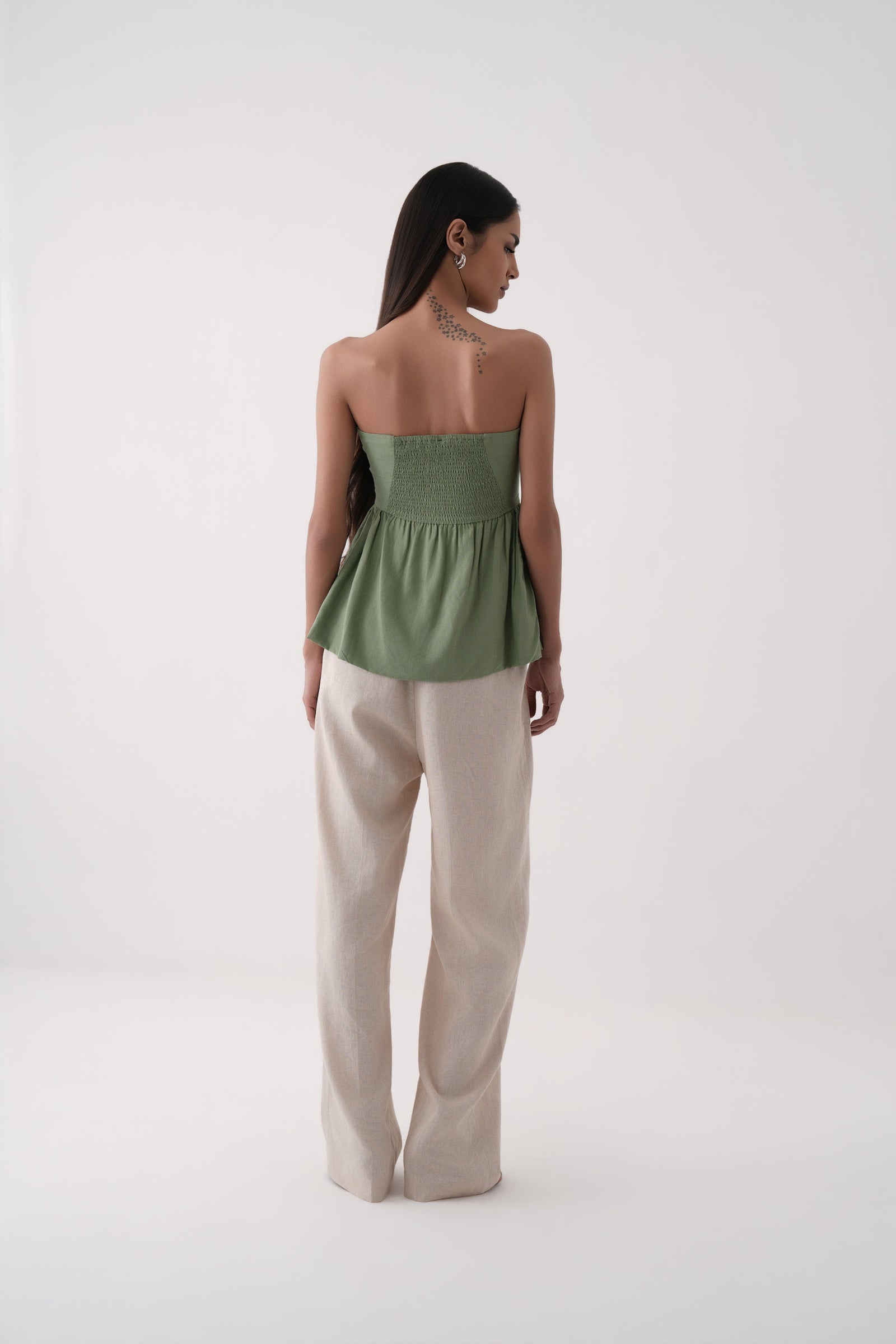 green strapless bubble hem peplum top