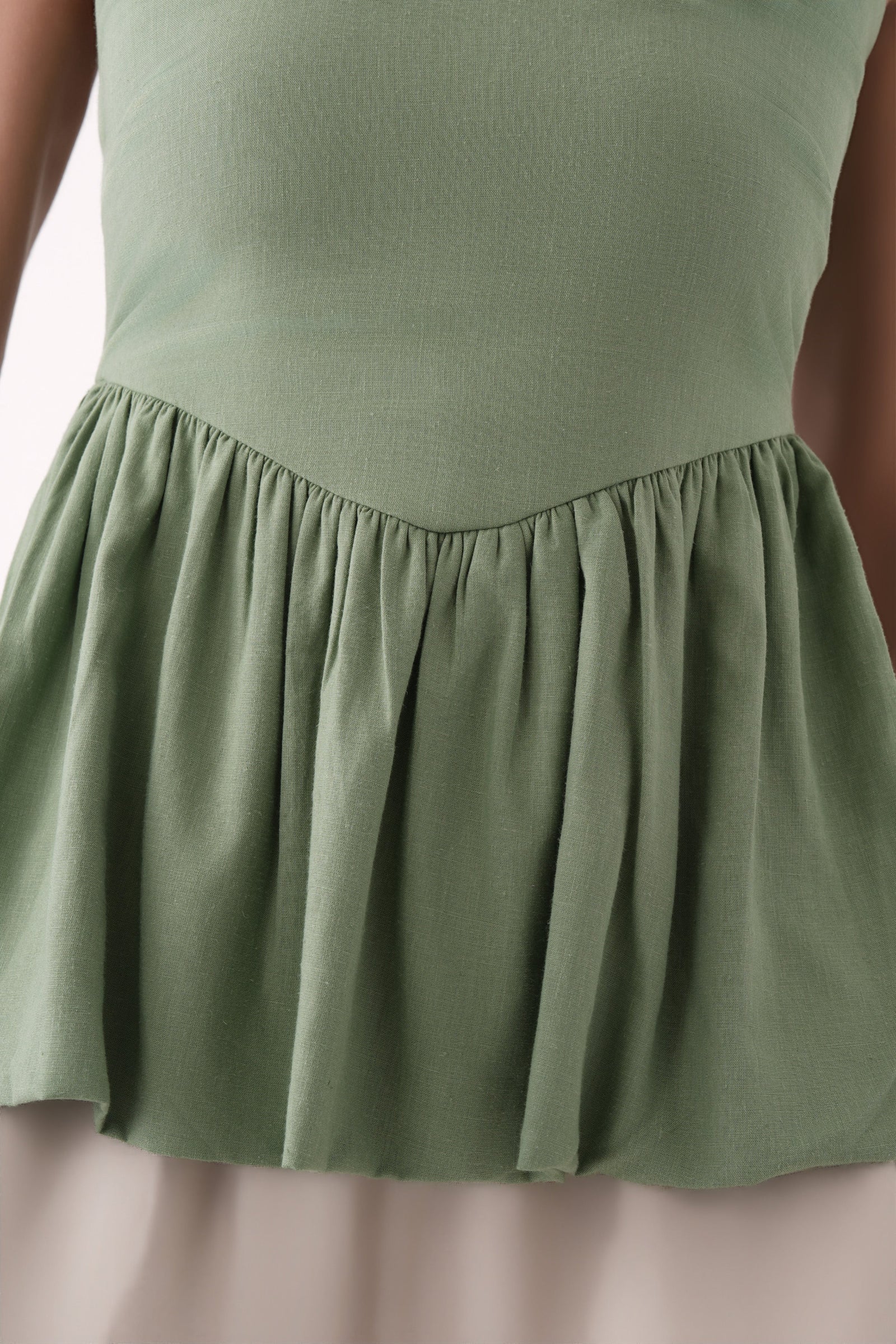green strapless bubble hem peplum top