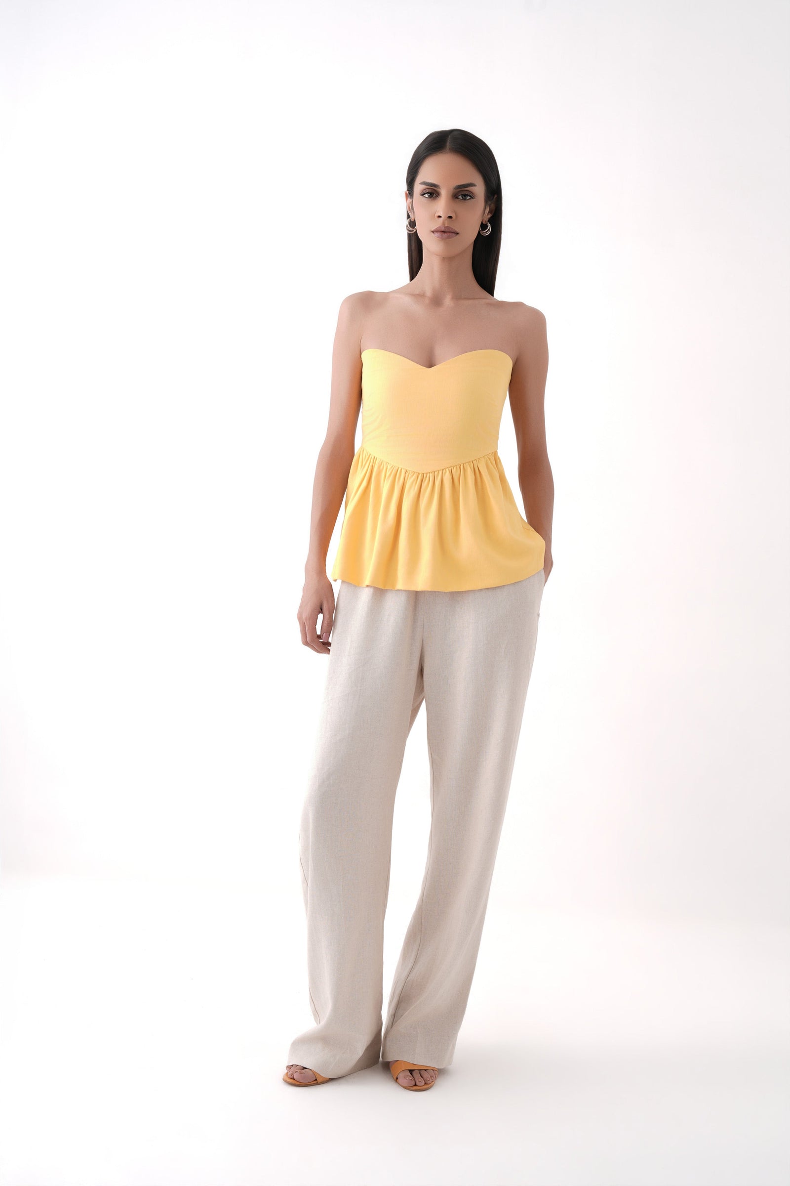 mustard strapless bubble hem peplum top