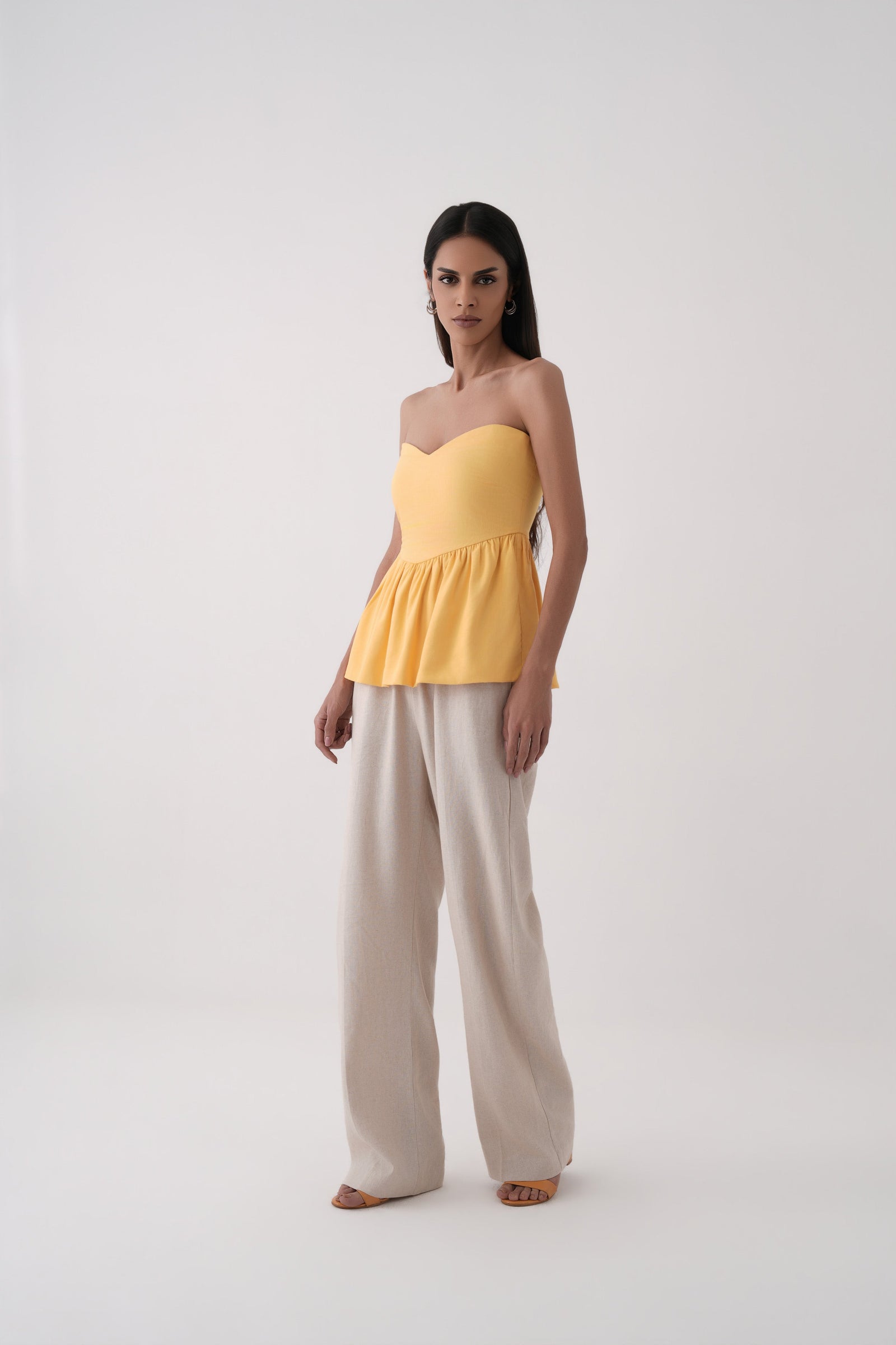 mustard strapless bubble hem peplum top