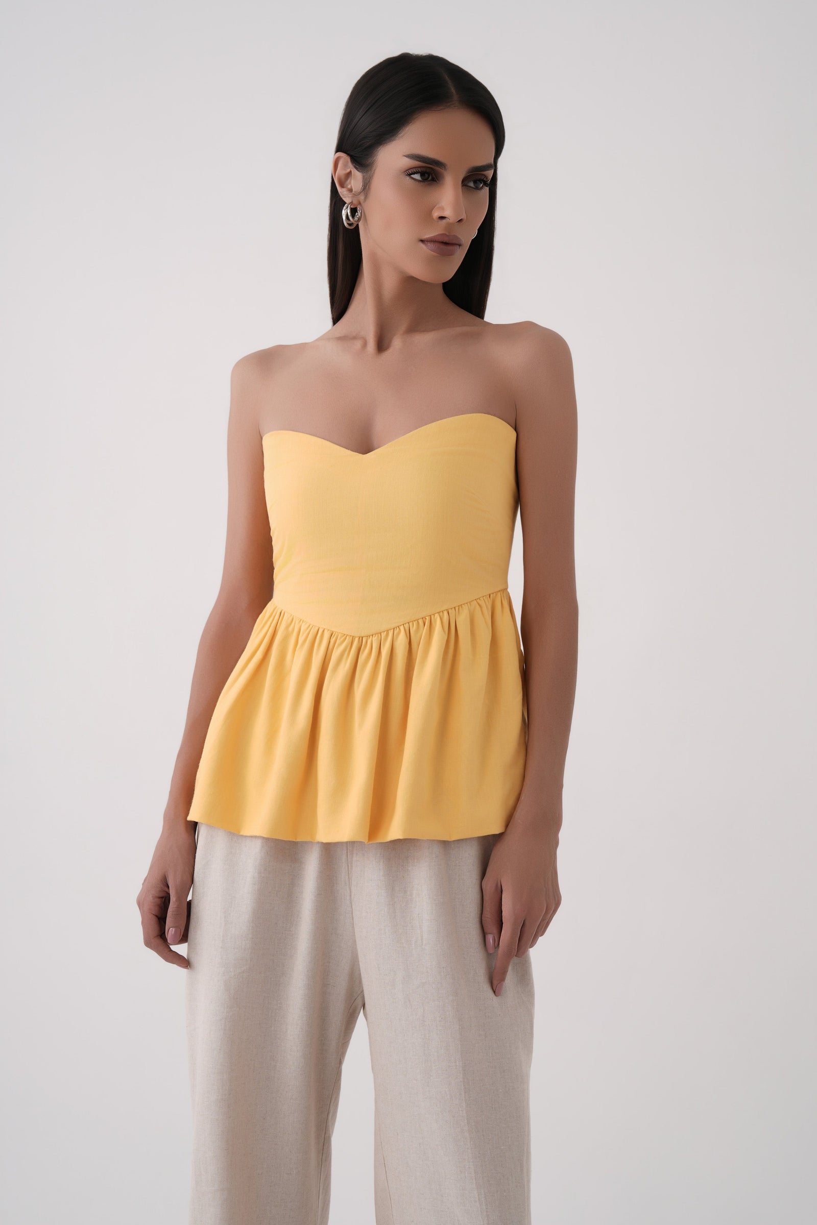 mustard strapless bubble hem peplum top