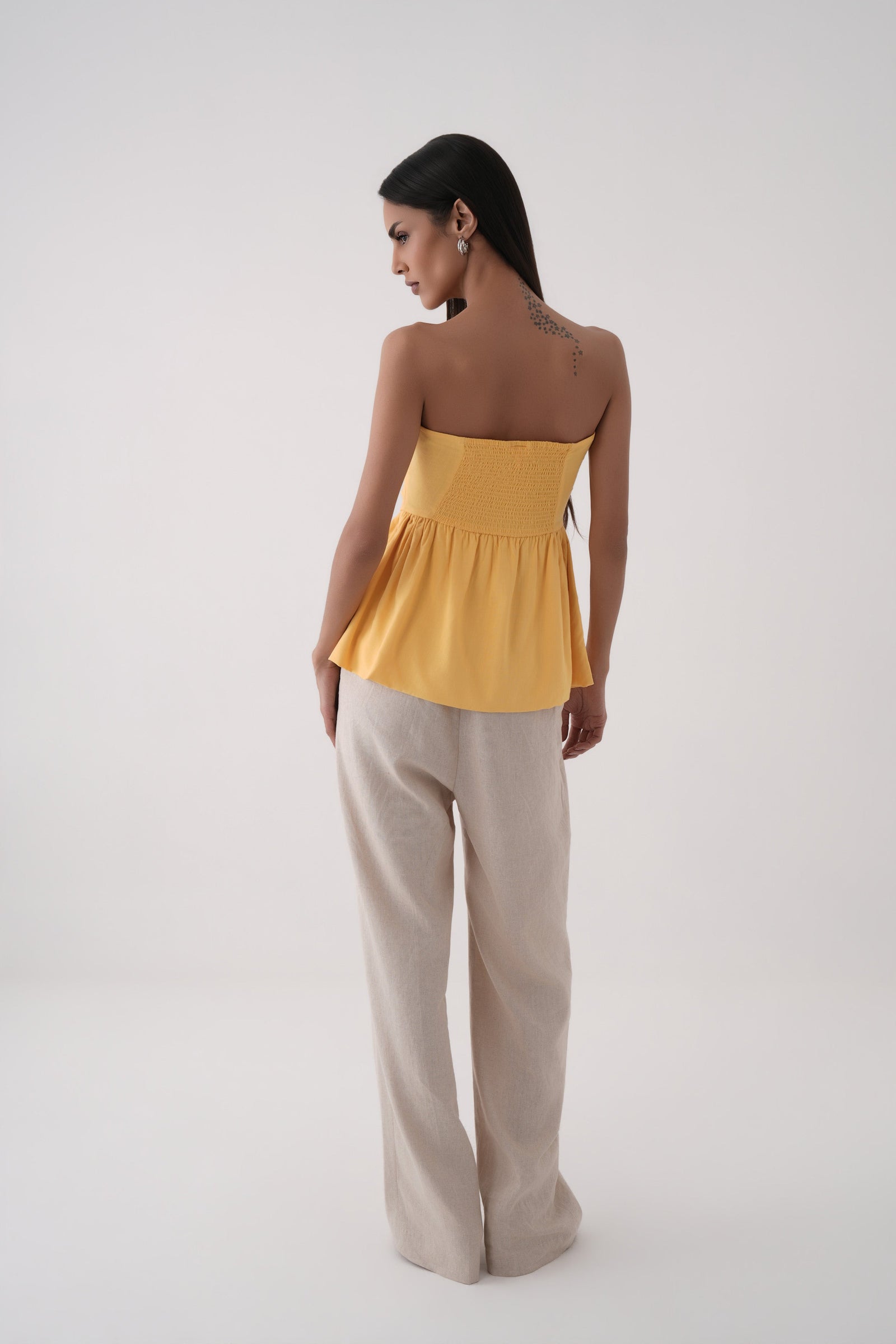 mustard strapless bubble hem peplum top