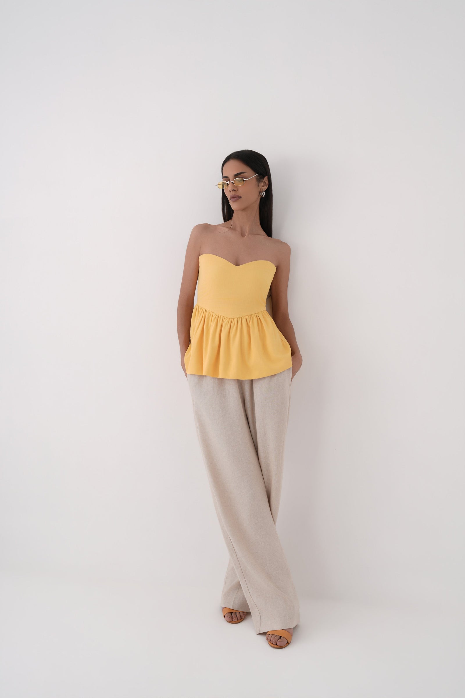 mustard strapless bubble hem peplum top